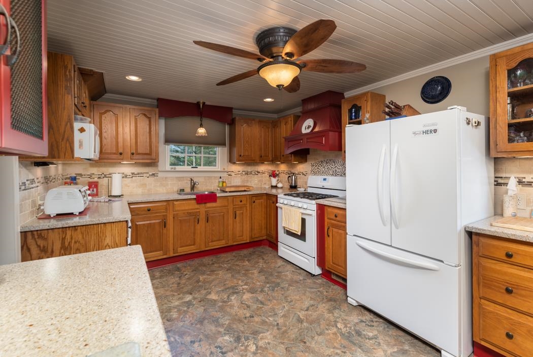 3643 Middlebrook Road Middlebrook, VA 24459 - Photo 14 of 35 a kitchen with refrigerator cabinets and window