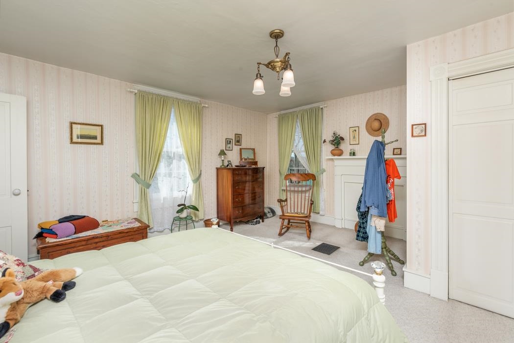 3643 Middlebrook Road Middlebrook, VA 24459 - Photo 21 of 35 a bedroom with a bed closet and wall painting