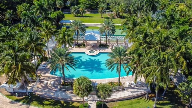 a view of a swimming pool with a patio and a garden