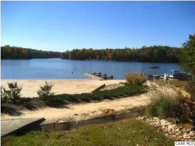 53 Dogleg Road Palmyra, VA 22963 - Photo 2 of 3 a view of a lake with houses in the background