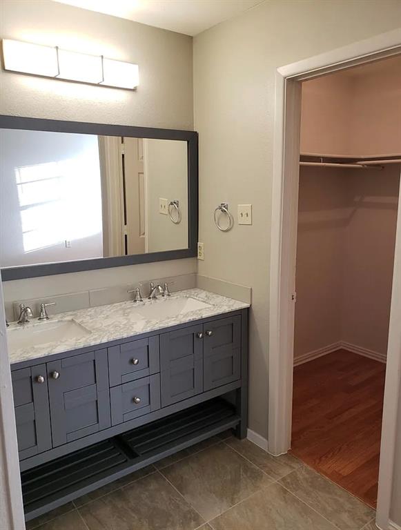 9693 Windy Ridge Road Frisco, TX 75033 - Photo 19 of 26 a bathroom with a granite countertop sink and a mirror