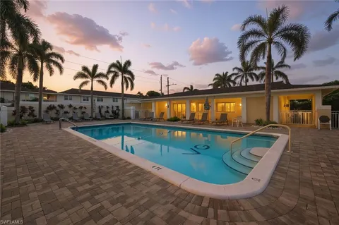 a view of swimming pool with a patio
