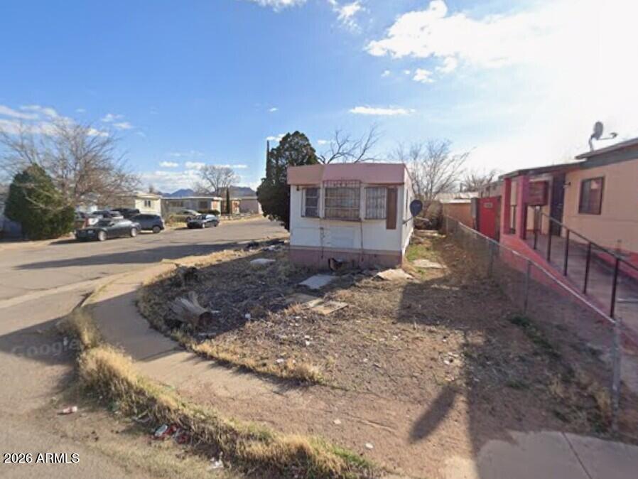 2245 Wigwam Circle, Unit 67 Douglas, AZ 85607 - Photo 7 of 8 a view of a house with a yard
