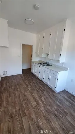 a view of cabinets and wooden floor