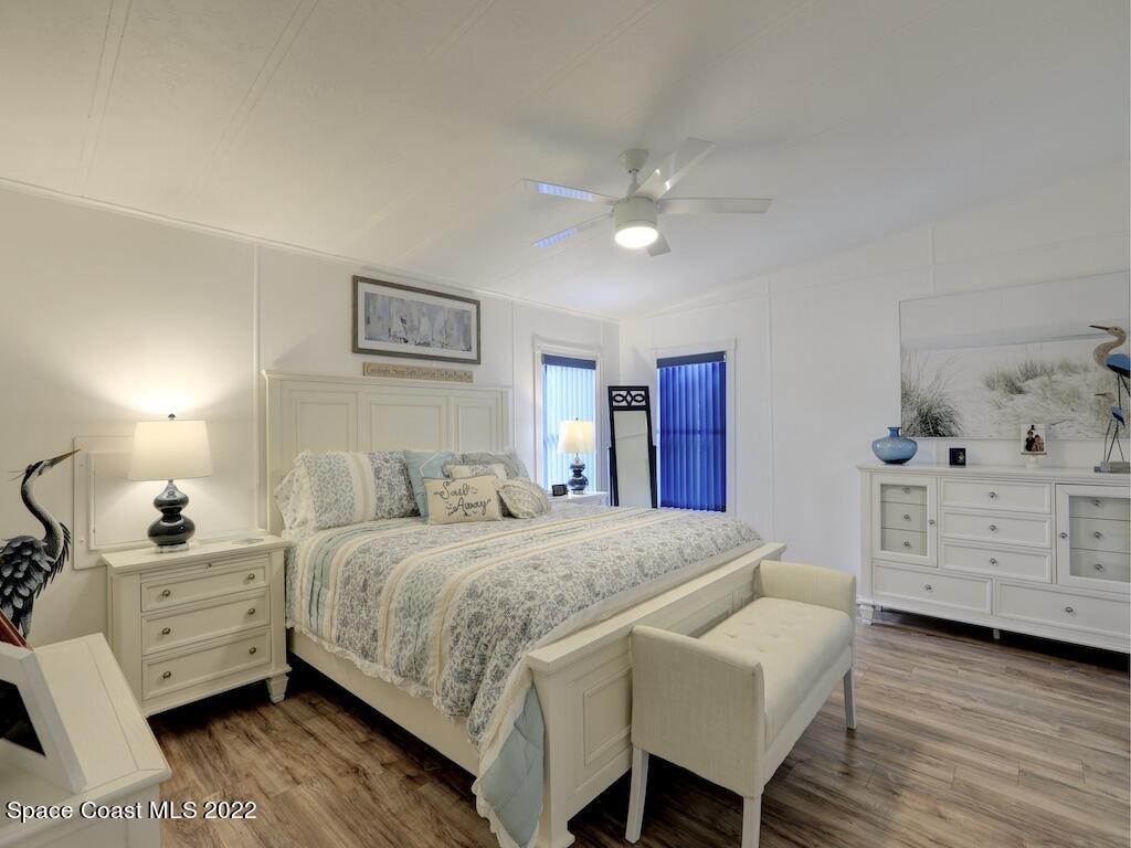 727 Periwinkle Drive Sebastian, FL 32976 - Photo 20 of 34 a bedroom with a bed and a dresser