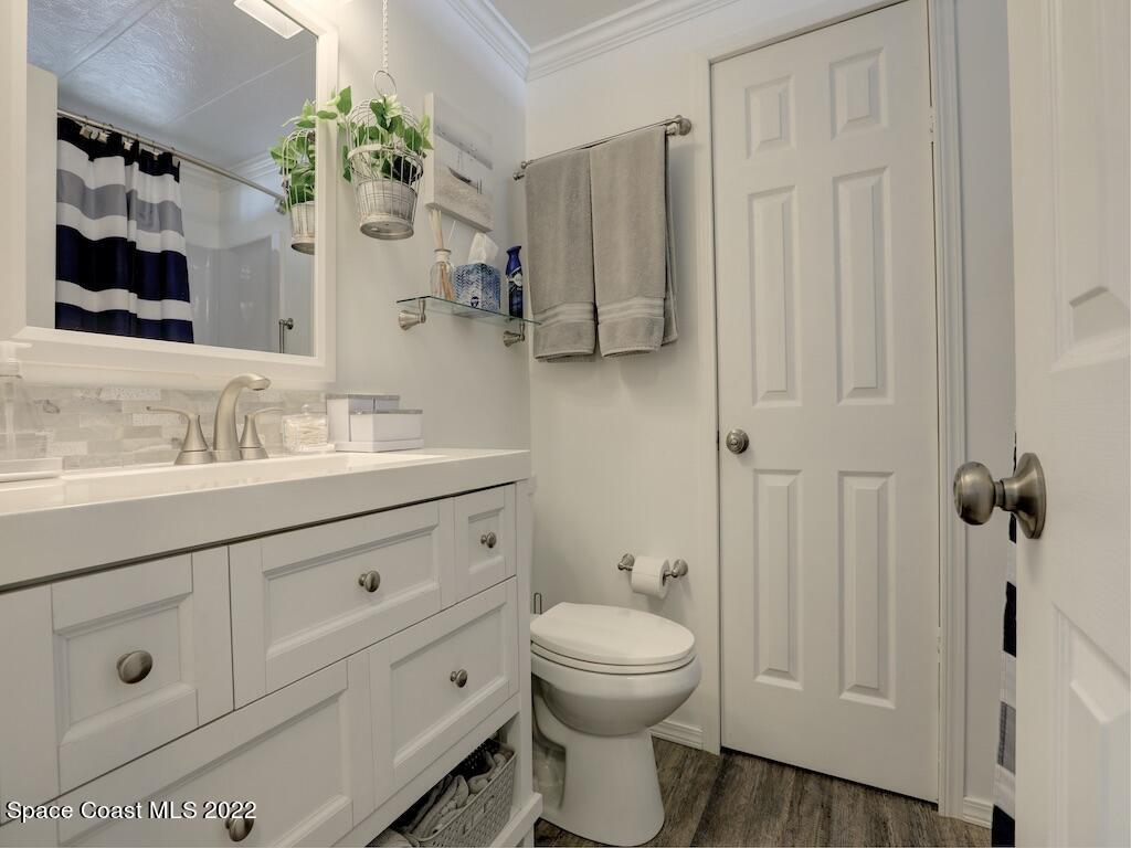 727 Periwinkle Drive Sebastian, FL 32976 - Photo 26 of 34 a bathroom with a sink a toilet and shower