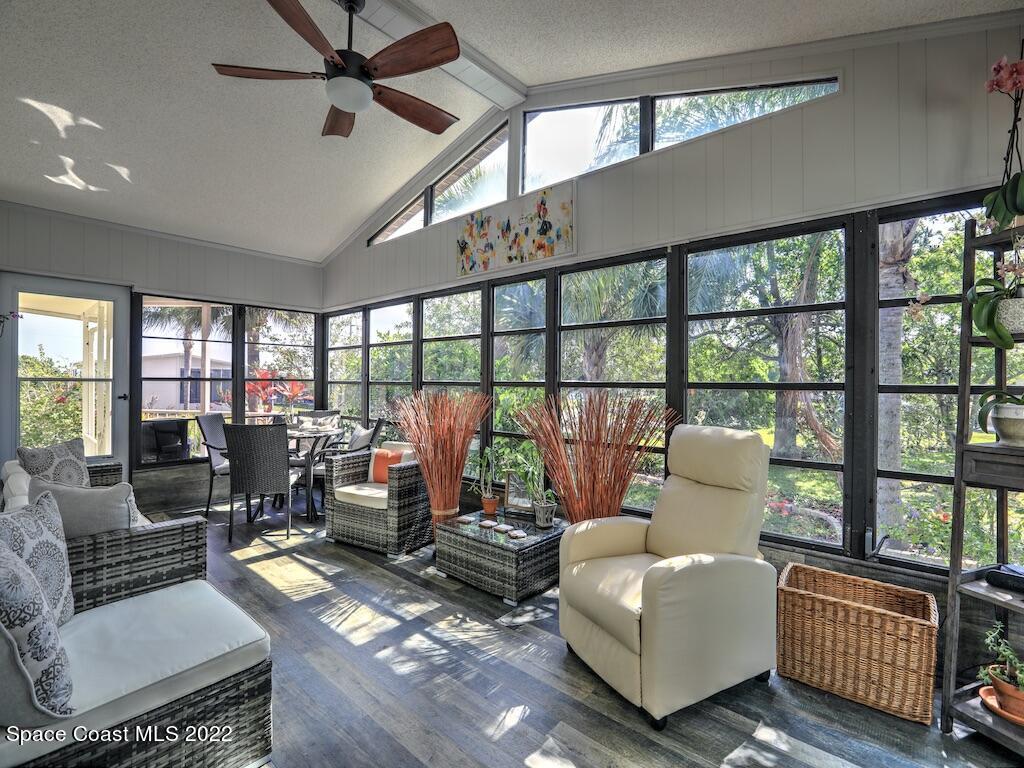 727 Periwinkle Drive Sebastian, FL 32976 - Photo 28 of 34 a living room with furniture or outdoor view and a large window
