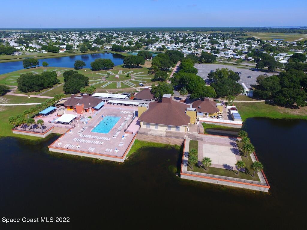 727 Periwinkle Drive Sebastian, FL 32976 - Photo 32 of 34 an aerial view of residential houses with outdoor space and swimming pool