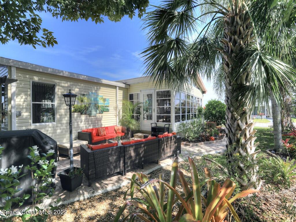 727 Periwinkle Drive Sebastian, FL 32976 - Photo 6 of 34 a view of a house with swimming pool and sitting area
