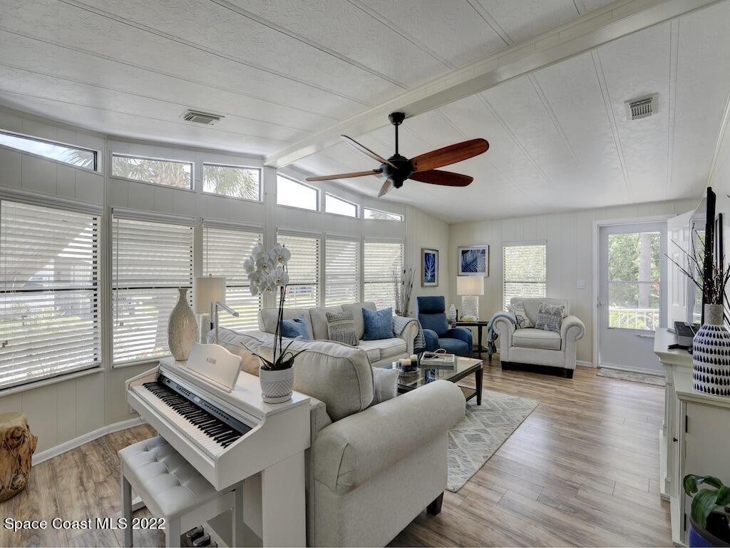727 Periwinkle Drive Sebastian, FL 32976 - Photo 10 of 34 a living room with furniture and a large window