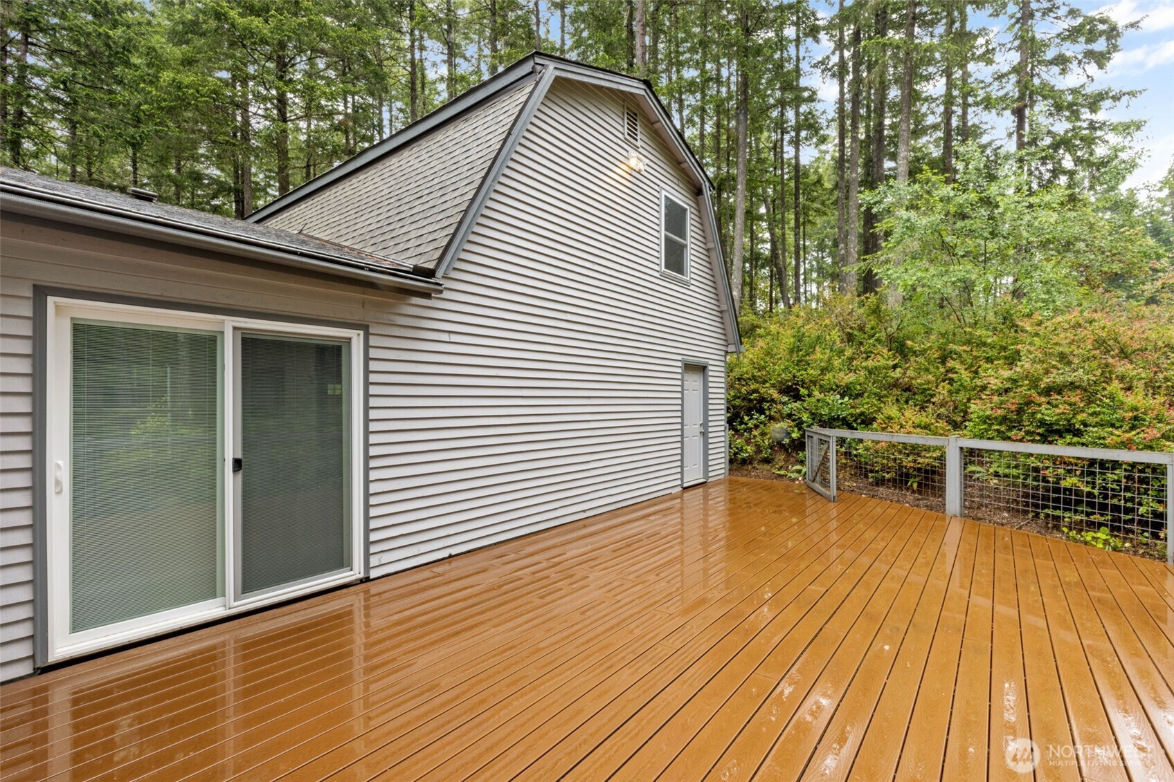 100 East Twanoh Heights Road South Belfair, WA 98528 - Photo 31 of 40 a view of a roof deck with wooden floor and fence