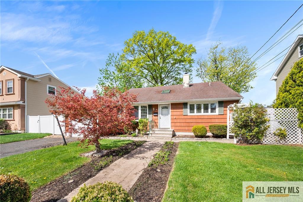 67 Drake Place Colonia, NJ 07067 - Photo 28 of 31 a front view of a house with a yard