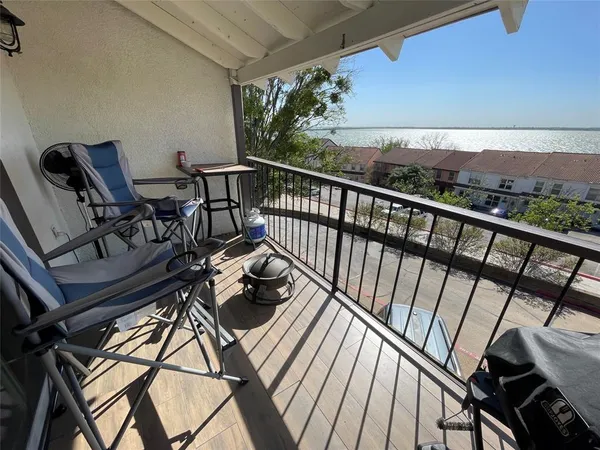 a view of a balcony with chairs