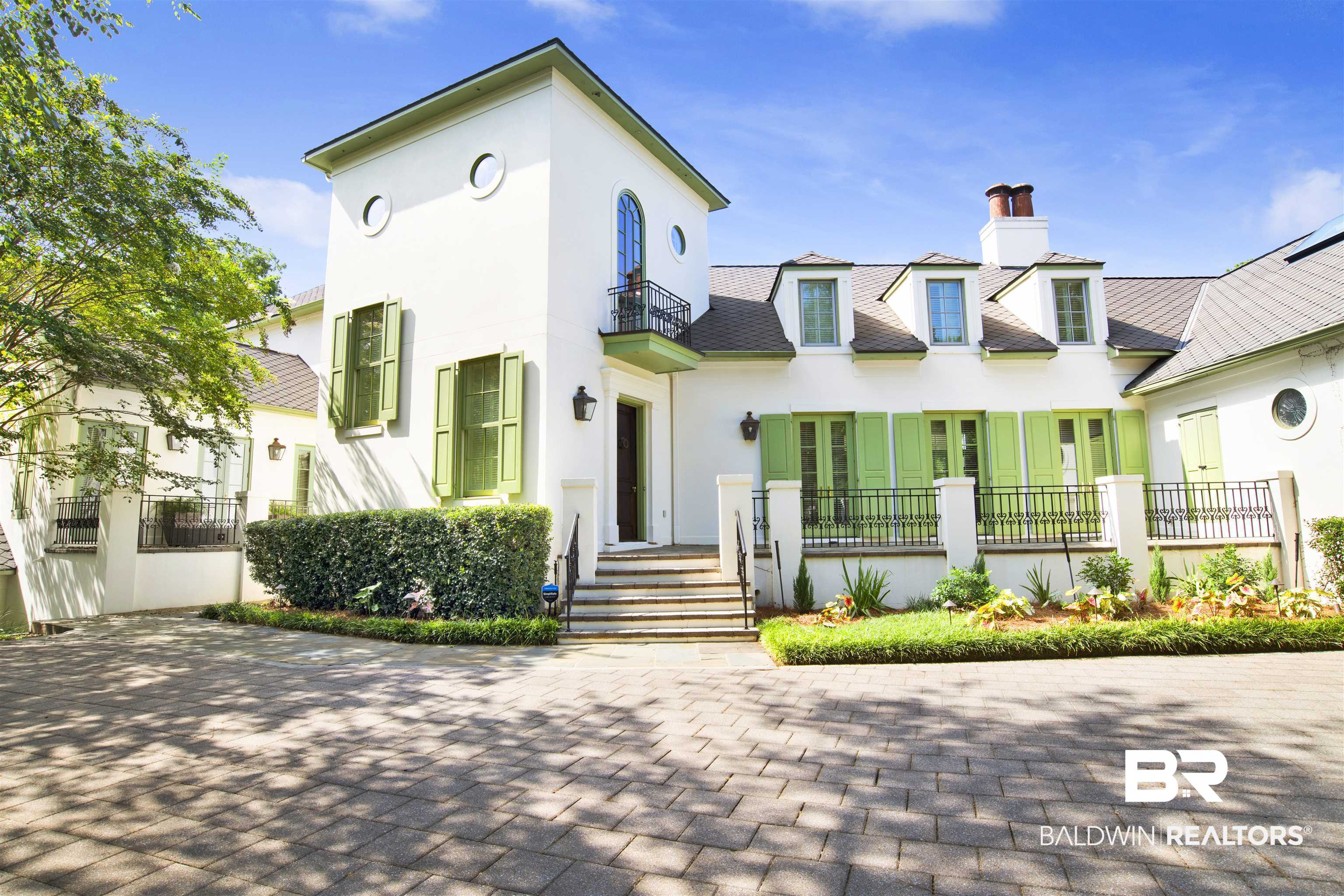 3816 Austill Lane Mobile, AL 36608 - Photo 1 of 80 View of front of house with a balcony, a chimney, and stucco siding