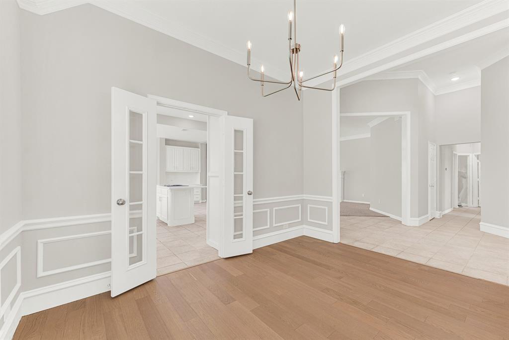 3500 Neiman Road Plano, TX 75025 - Photo 3 of 26 The dining room is perfect for any size and style of furniture, with French doors to the kitchen, plus laminate flooring installed 2026!