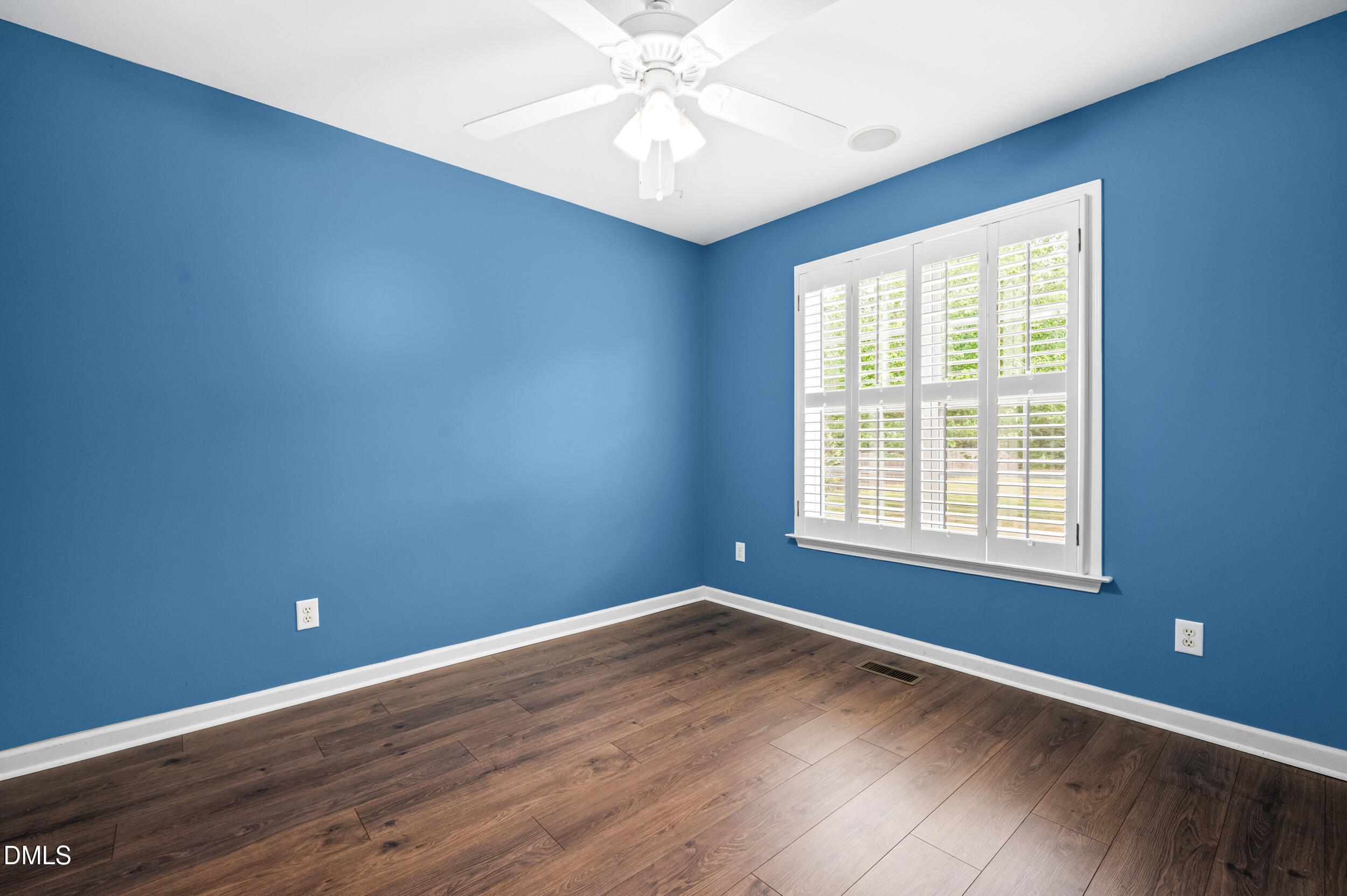 125 Rustic Lane Smithfield, NC 27577 - Photo 28 of 49 an empty room with a window and a fan