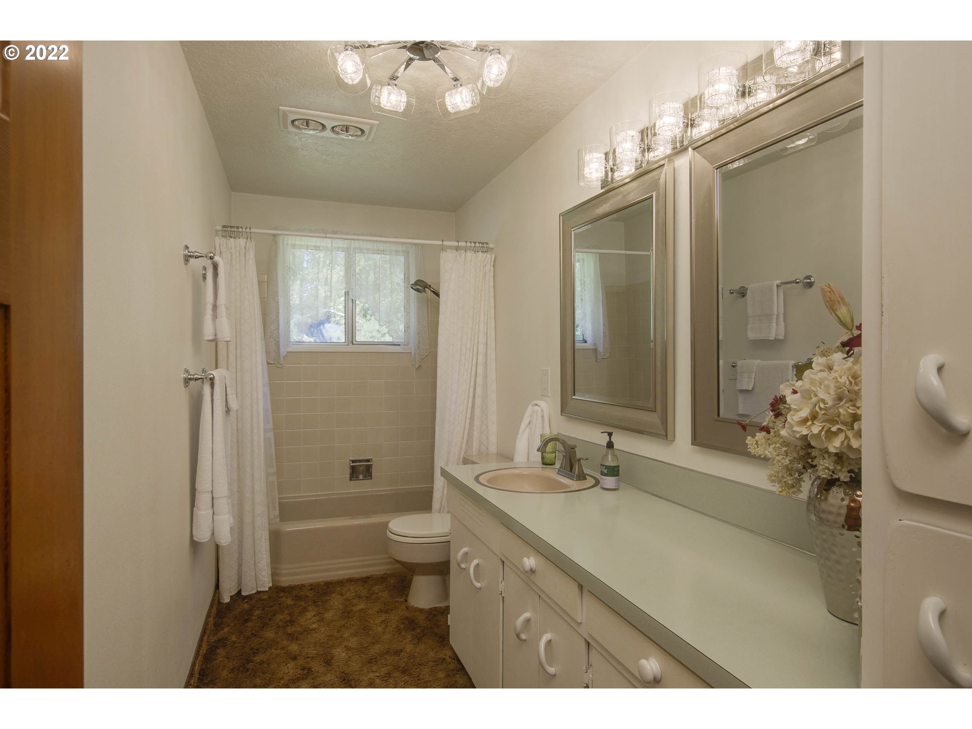 10419 Crosby Road Northeast Woodburn, OR 97071 - Photo 17 of 32 a bathroom with a granite countertop sink toilet and shower