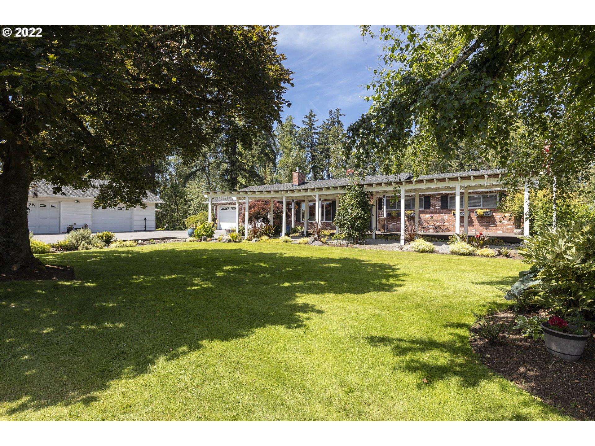 10419 Crosby Road Northeast Woodburn, OR 97071 - Photo 2 of 32 a view of a house with a big yard