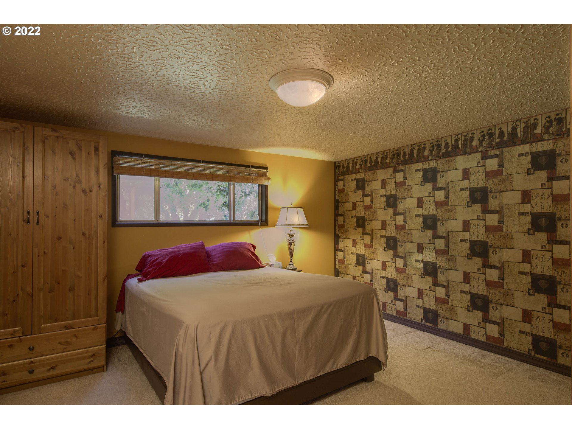 10419 Crosby Road Northeast Woodburn, OR 97071 - Photo 22 of 32 a bedroom with a bed and a painting on the wall