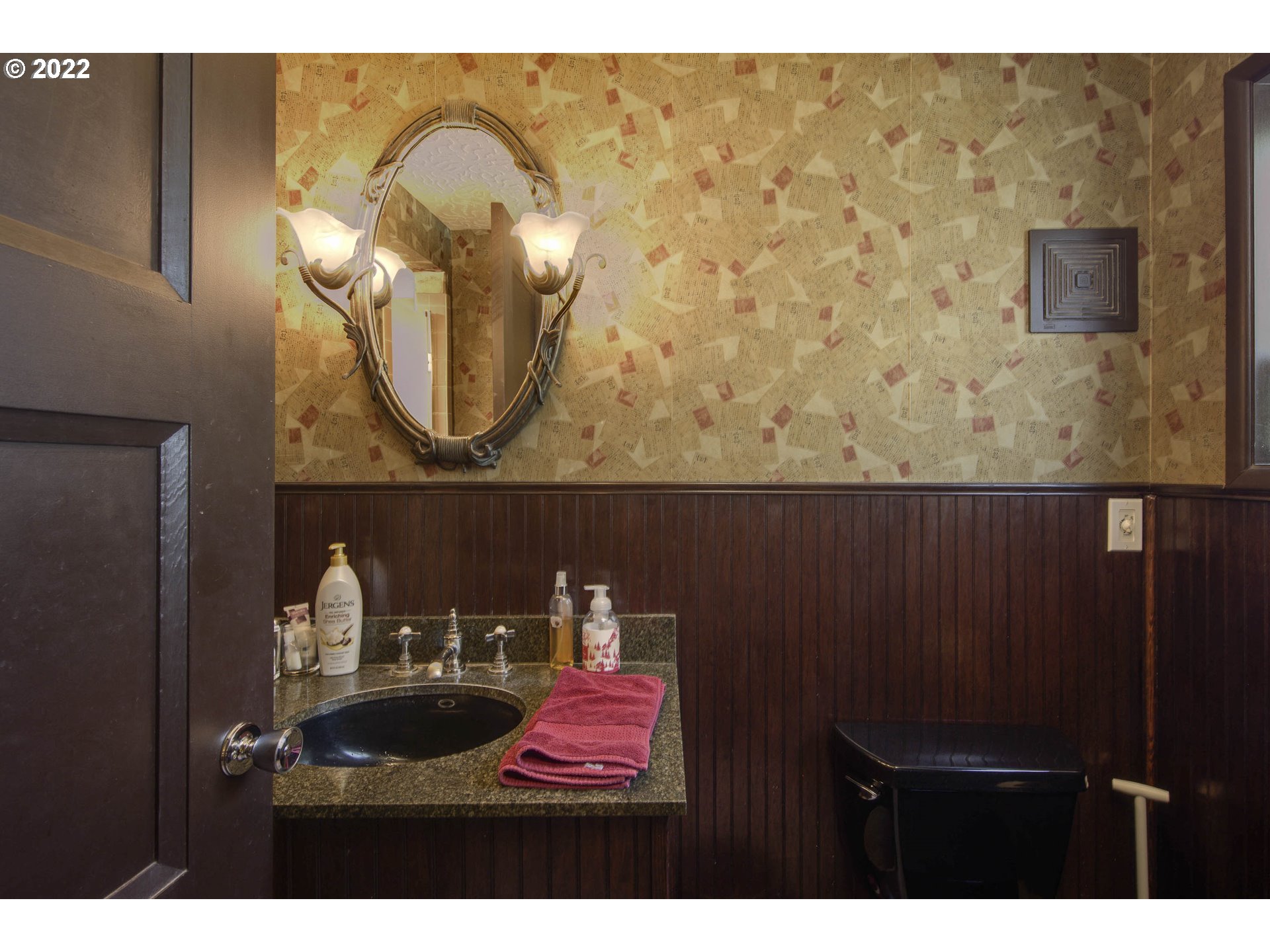 10419 Crosby Road Northeast Woodburn, OR 97071 - Photo 23 of 32 a bathroom with a sink and a mirror
