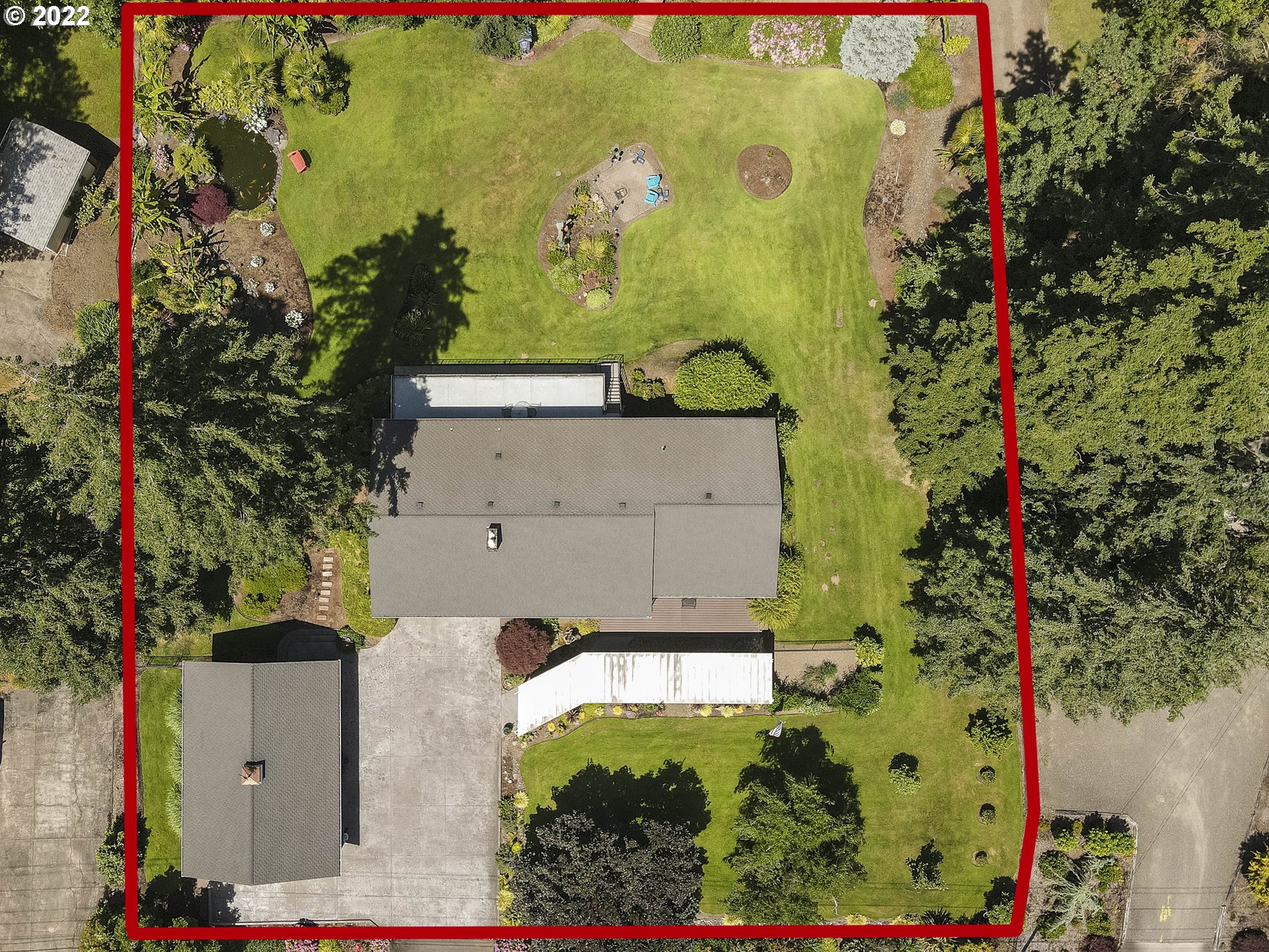 10419 Crosby Road Northeast Woodburn, OR 97071 - Photo 30 of 32 an aerial view of a house with a yard