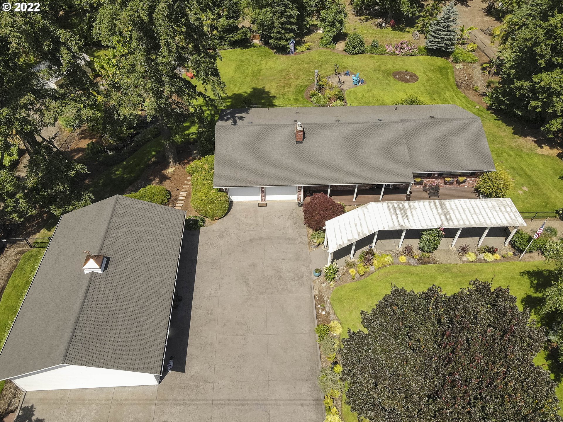 10419 Crosby Road Northeast Woodburn, OR 97071 - Photo 31 of 32 an aerial view of a house with yard swimming pool and outdoor seating