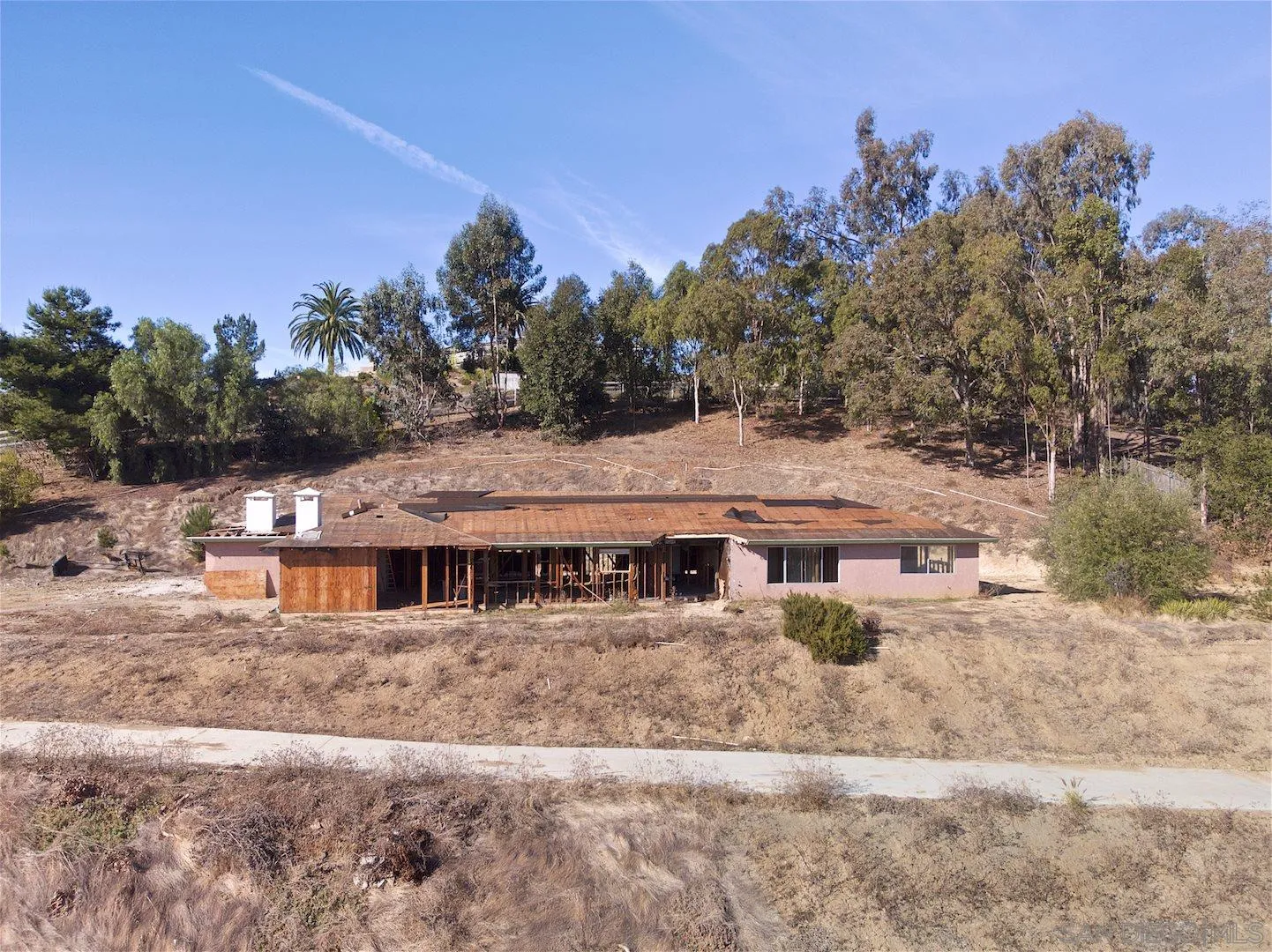3572 Copper Crest Road Encinitas, CA 92024 - Photo 1 of 16 a view of a big house with a yard and plants