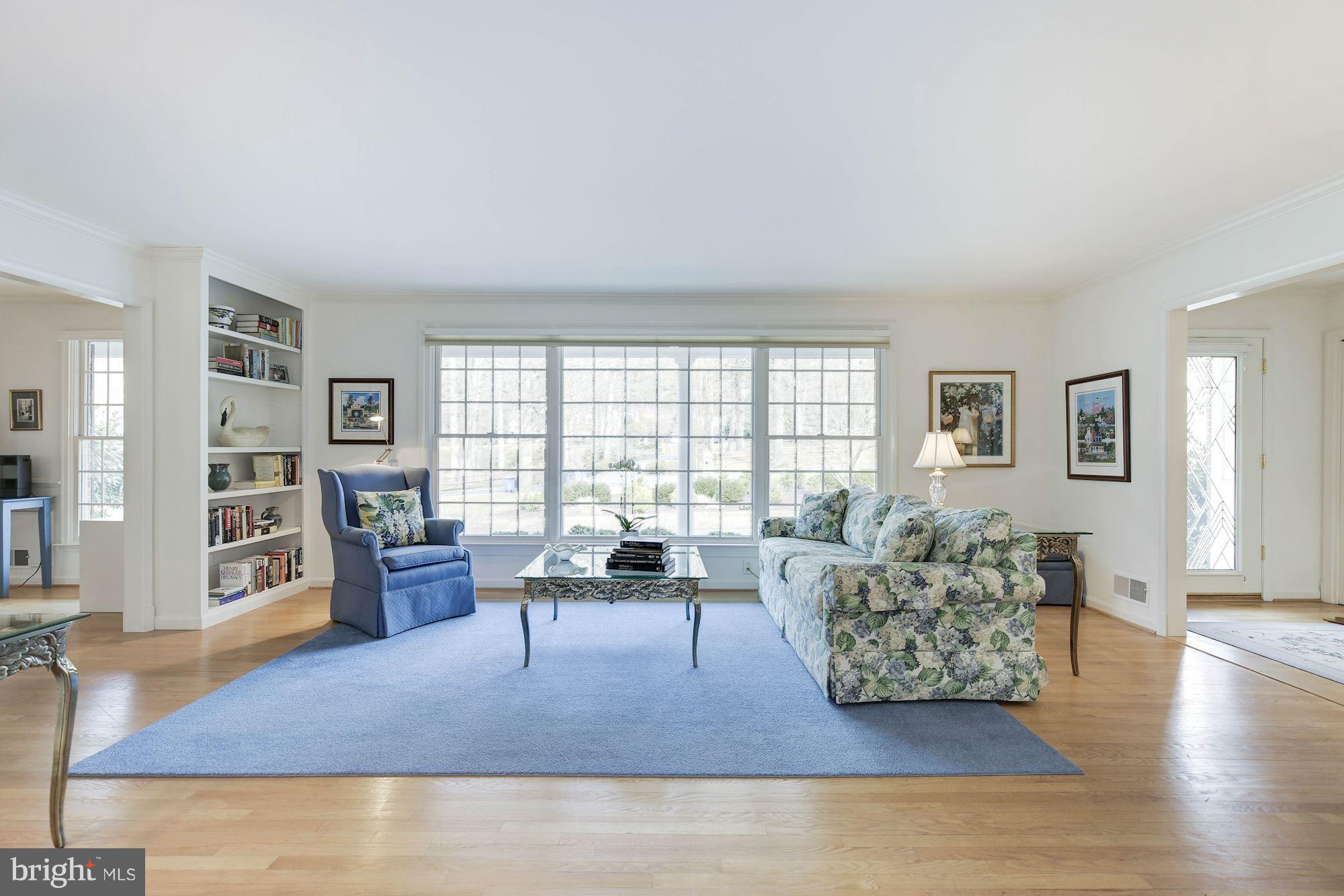 8821 Belmart Road Potomac, MD 20854 - Photo 2 of 29 a living room with furniture and a wooden floor