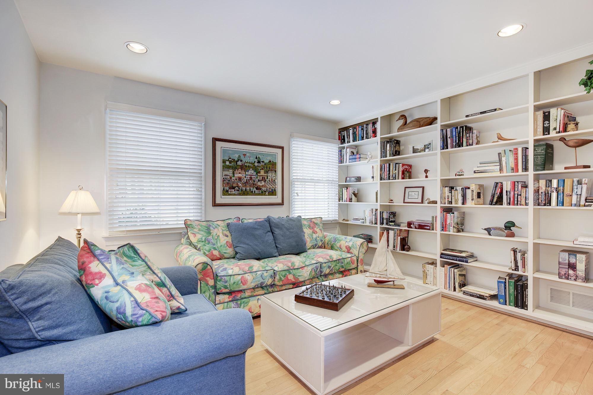 8821 Belmart Road Potomac, MD 20854 - Photo 12 of 29 a living room with furniture and a book shelf