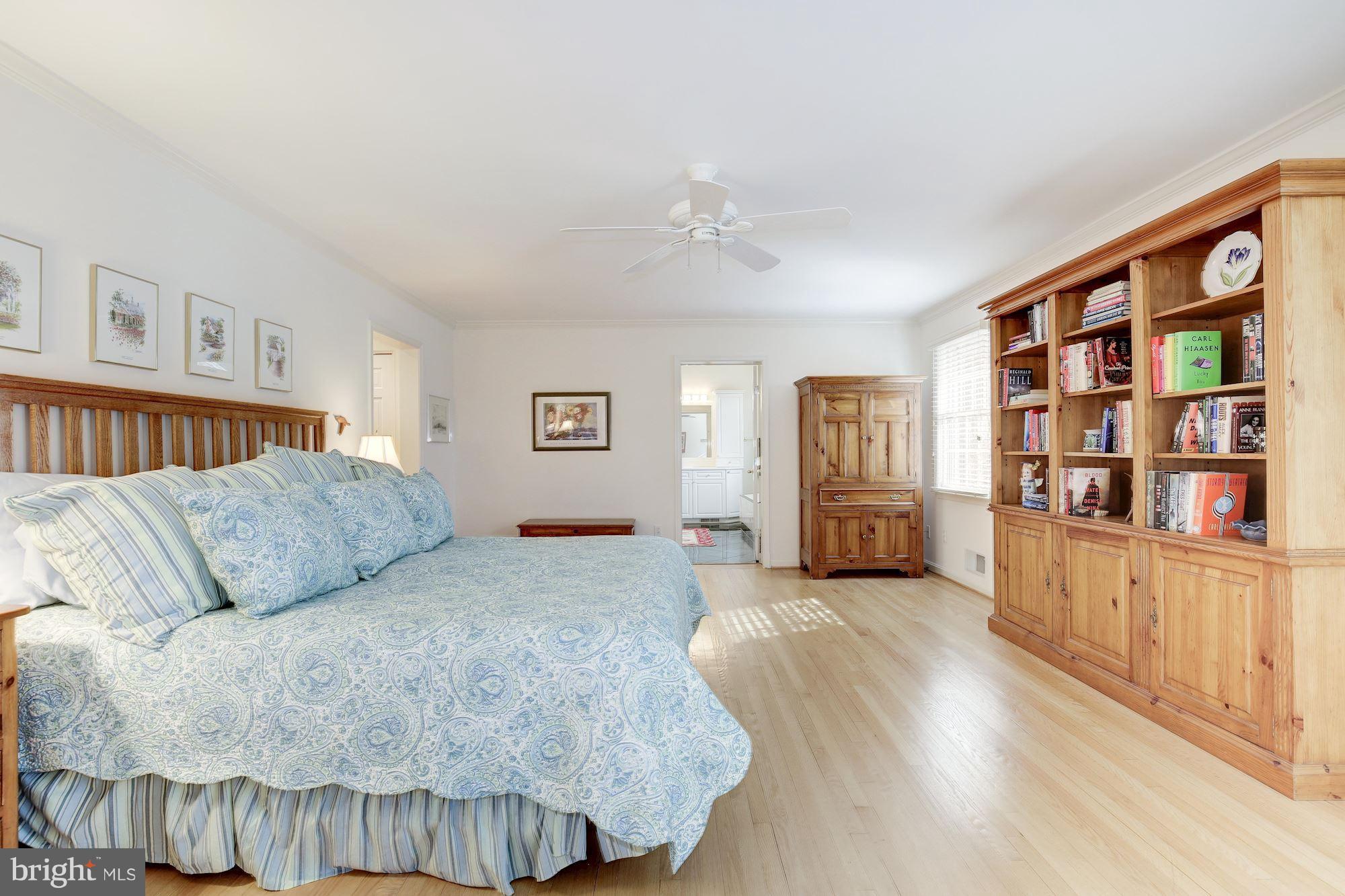 8821 Belmart Road Potomac, MD 20854 - Photo 14 of 29 a living room with furniture and a book shelf