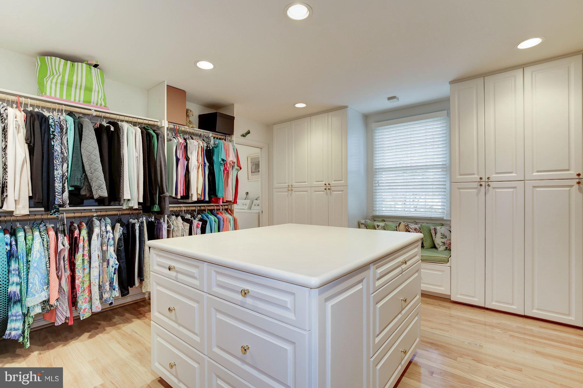 8821 Belmart Road Potomac, MD 20854 - Photo 18 of 29 a view of walk in closet with clothes and shoes