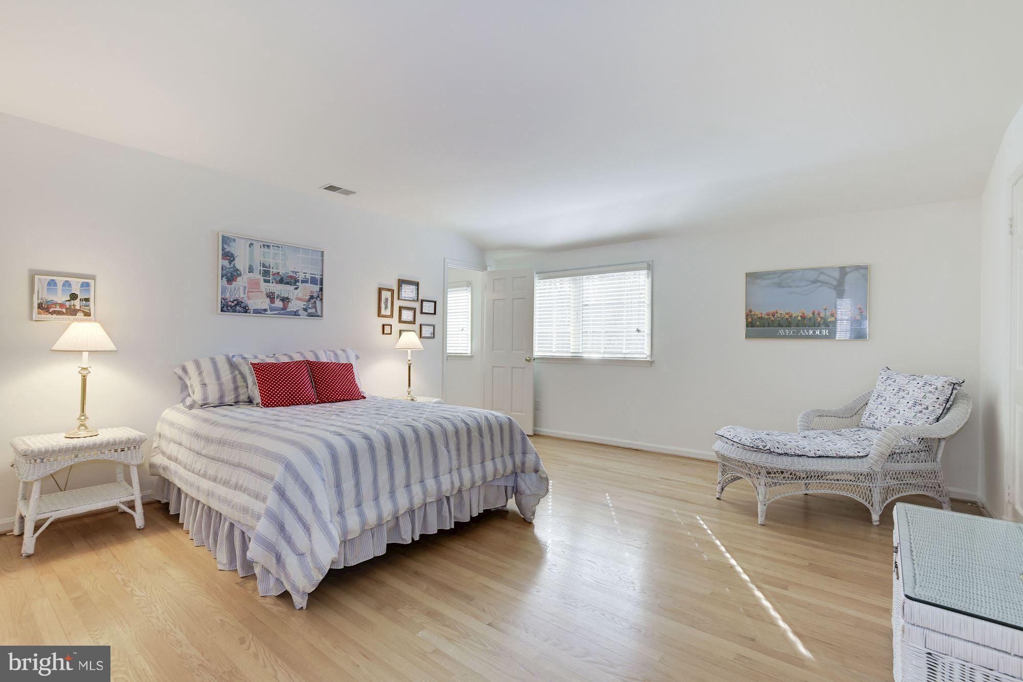 8821 Belmart Road Potomac, MD 20854 - Photo 20 of 29 a bedroom with a bed and a couch