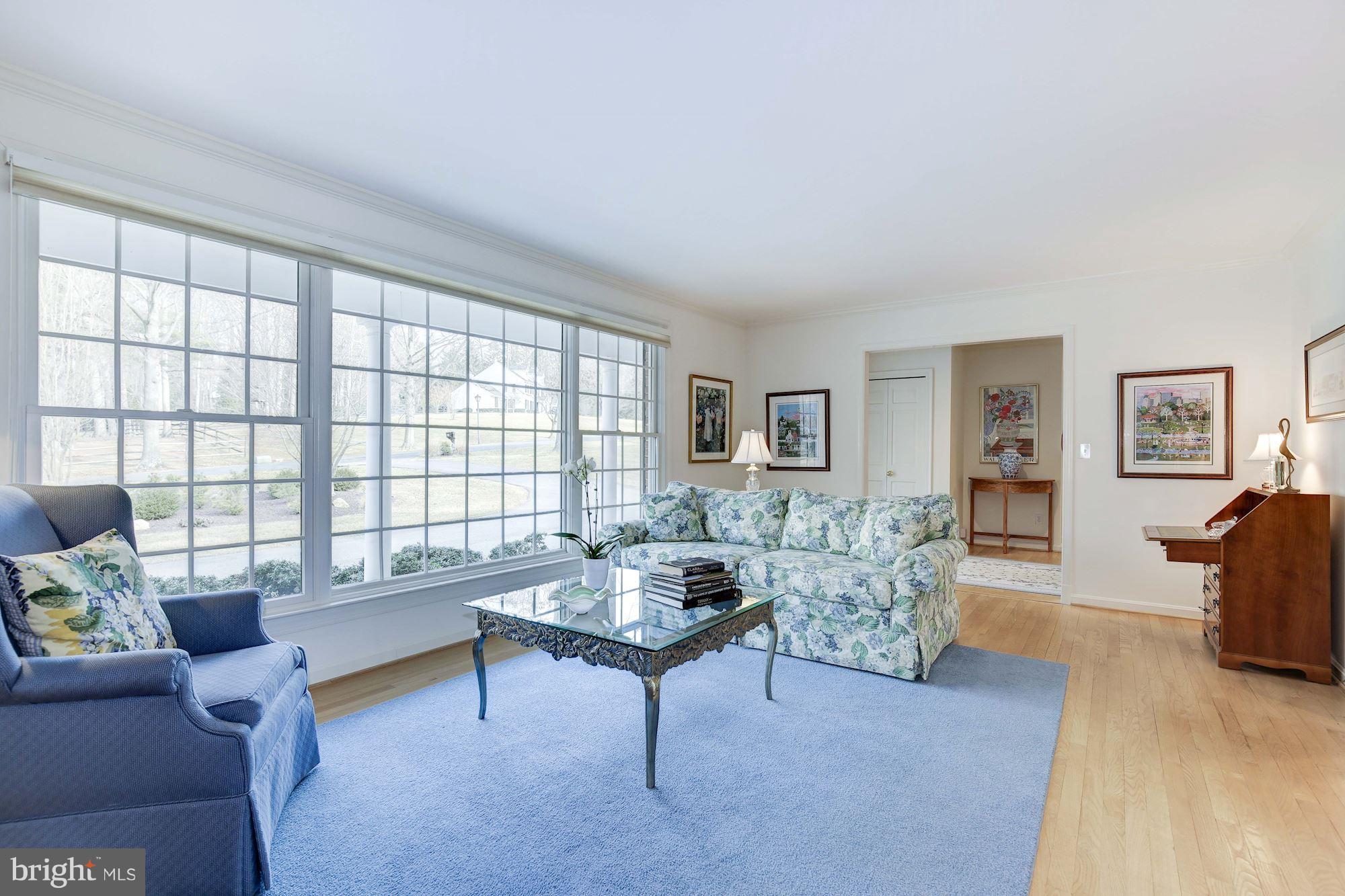 8821 Belmart Road Potomac, MD 20854 - Photo 3 of 29 a living room with furniture and a window