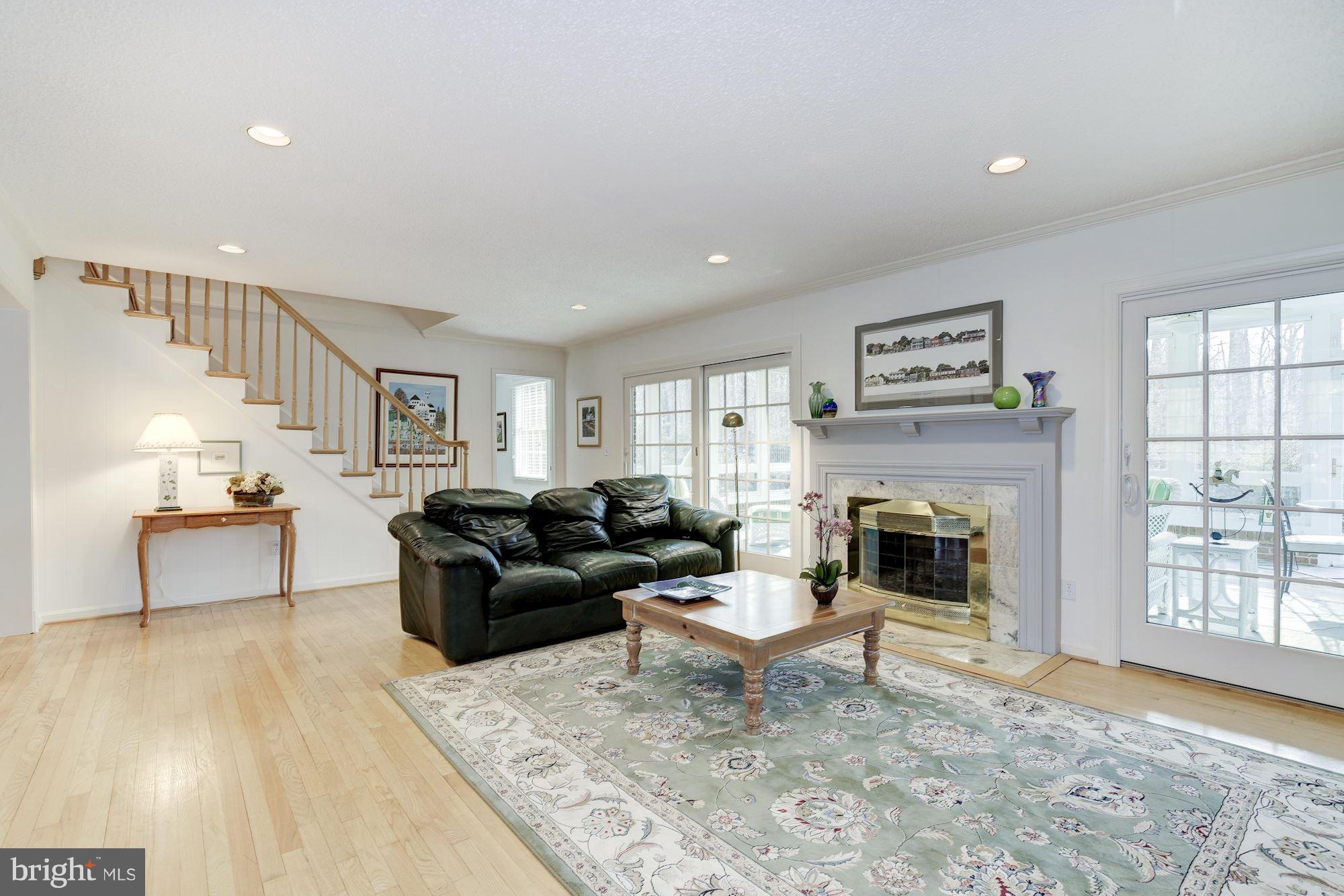 8821 Belmart Road Potomac, MD 20854 - Photo 9 of 29 a living room with furniture and a fireplace