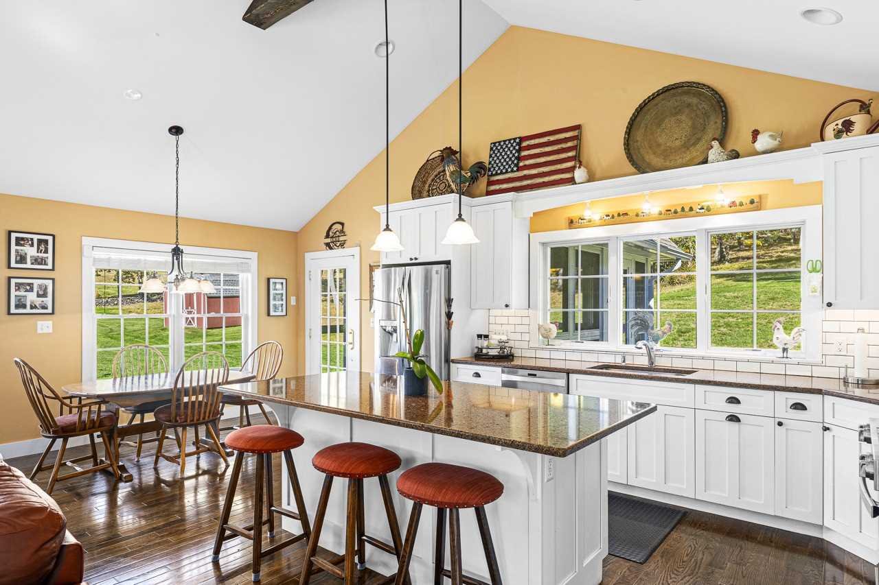 368 Skiba Road Gallatin, NY 12523 - Photo 12 of 40 a view of a dining room with furniture a chandelier and wooden floor