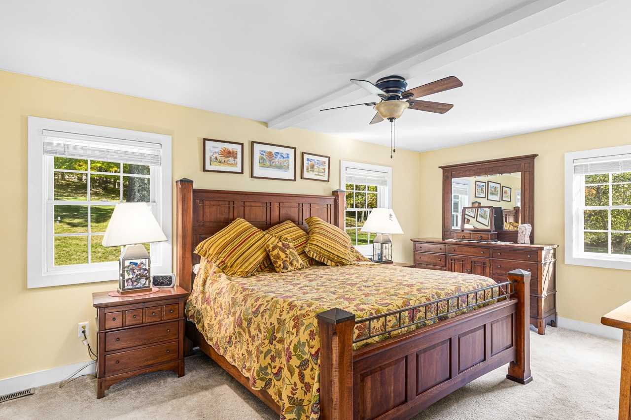 368 Skiba Road Gallatin, NY 12523 - Photo 15 of 40 a bedroom with a bed and a chandelier