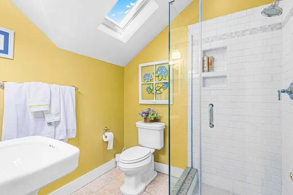 a bathroom with a sink a toilet and bathtub