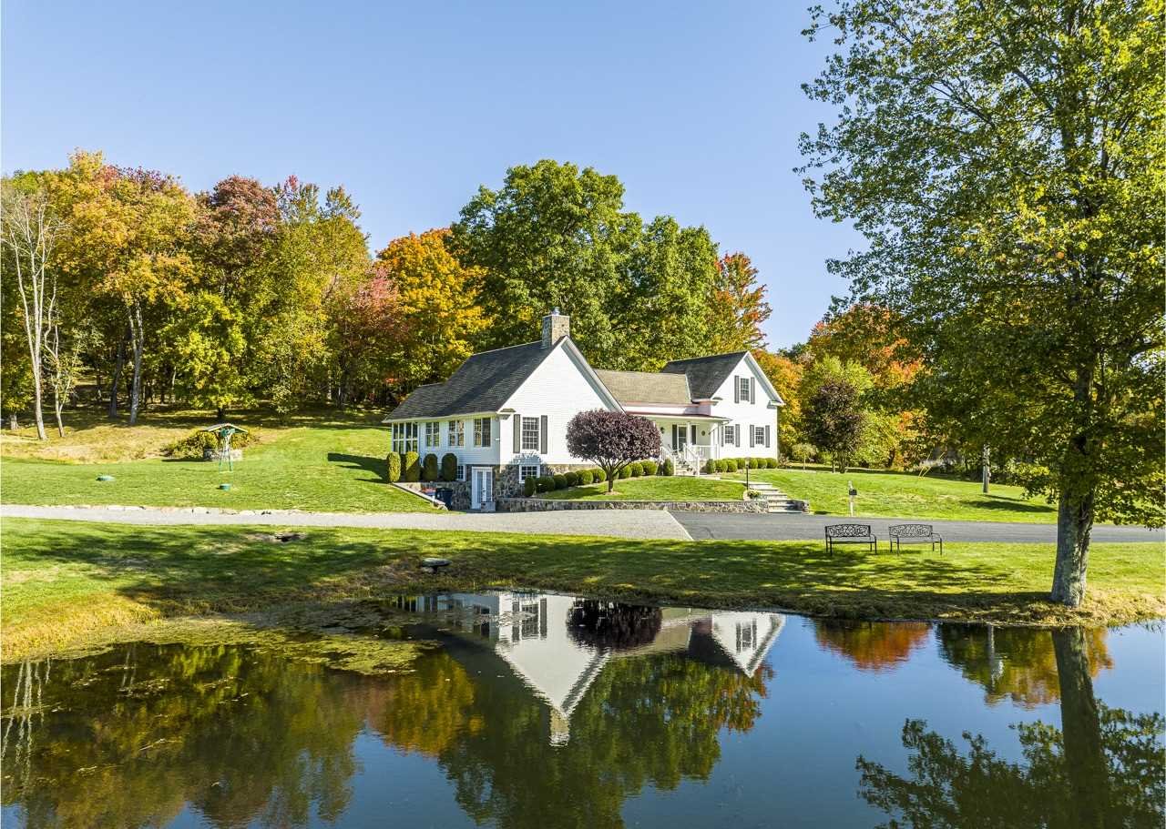 368 Skiba Road Gallatin, NY 12523 - Photo 31 of 40 a view of a house with a yard and a large tree