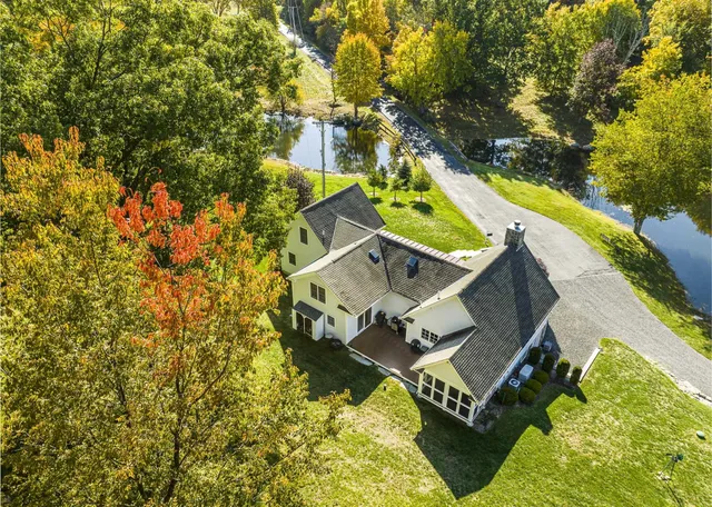 a view of a house with backyard porch and furniture