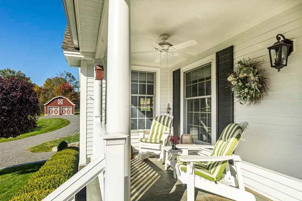 a view of a patio with table and chairs and potted plants