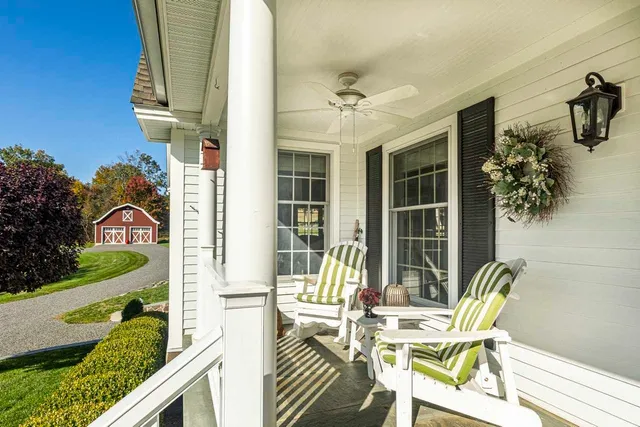 a view of a patio with table and chairs and potted plants