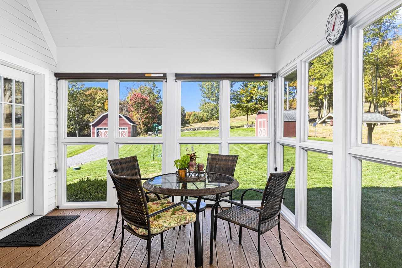 368 Skiba Road Gallatin, NY 12523 - Photo 10 of 40 a view of a dining room with furniture large windows and wooden floor