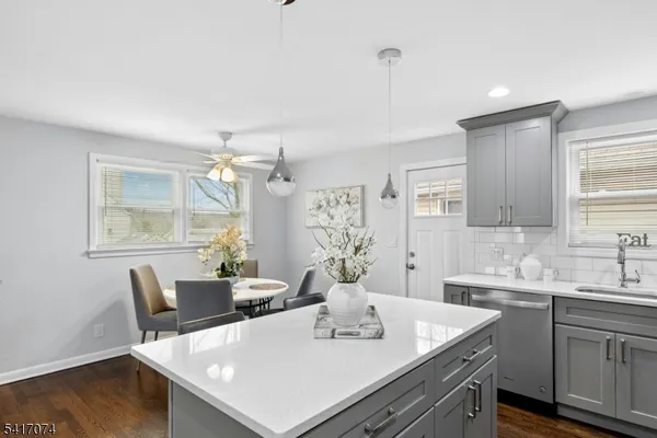 a view of kitchen with a table and chairs