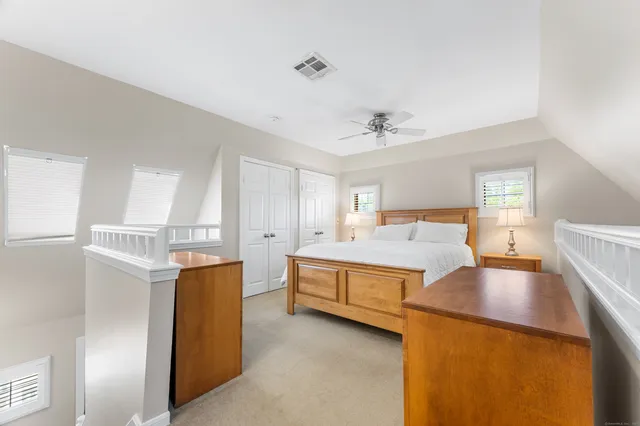 a bed room with a bed and window