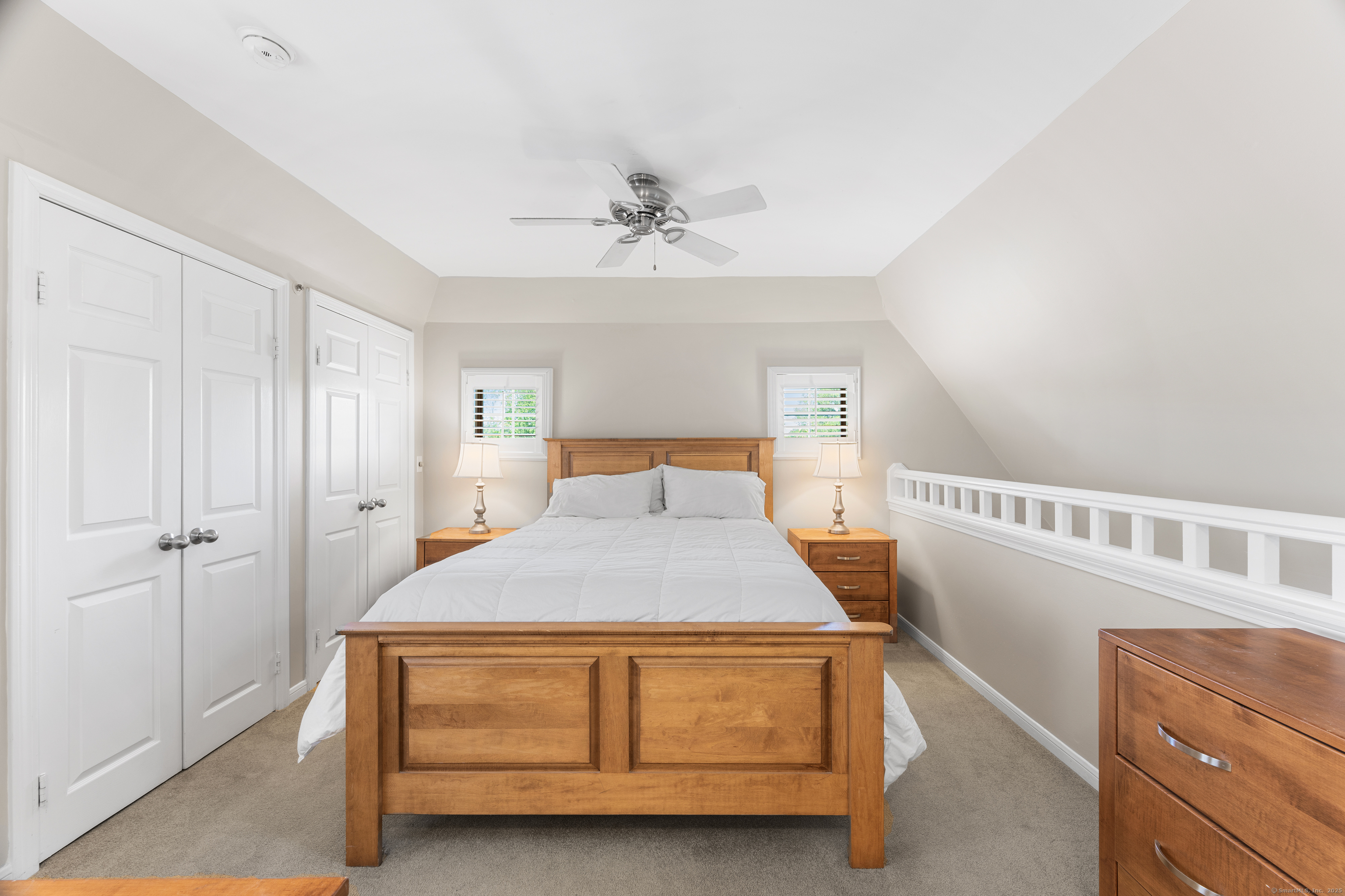 2124 Old Pond Lane, Unit 2124 Norwich, CT 06360 - Photo 16 of 30 a bedroom with a bed and a chandelier