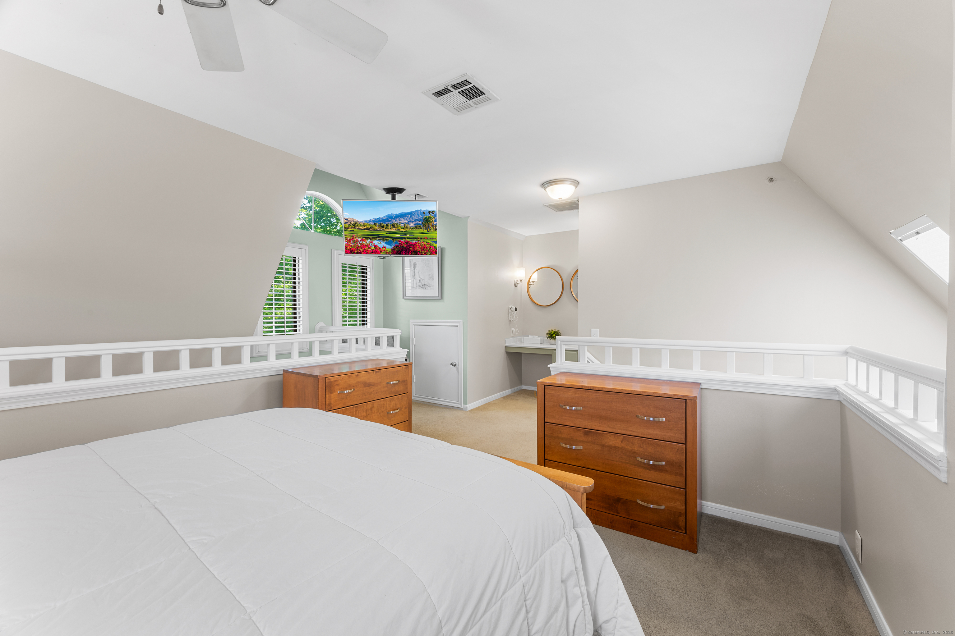 2124 Old Pond Lane, Unit 2124 Norwich, CT 06360 - Photo 17 of 30 a bedroom with a bed and a cabinets