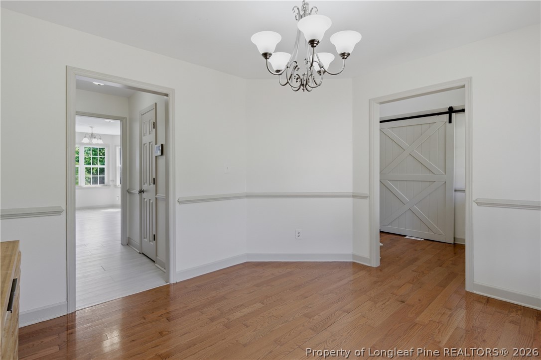 1075 Buffalo Lake Road Sanford, NC 27332 - Photo 9 of 49 an empty room with wooden floor