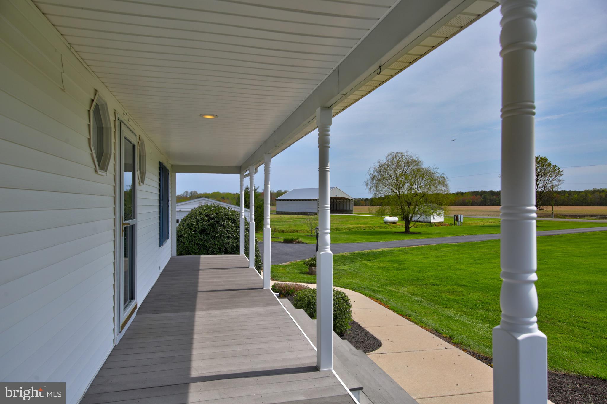 12233 Collins Road Bishopville, MD 21813 - Photo 41 of 78 Expansive Front Porch