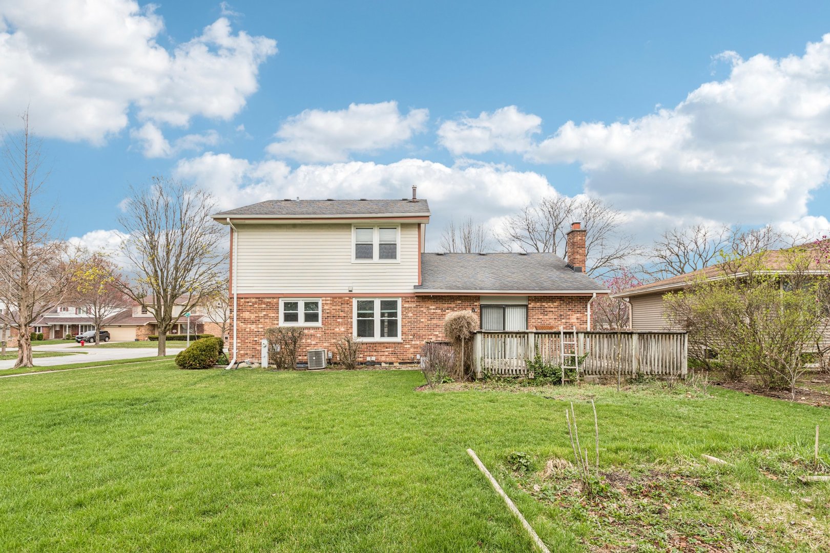 18604 Carpenter Street Homewood, IL 60430 - Photo 26 of 31 a view of a house with a big yard and large trees