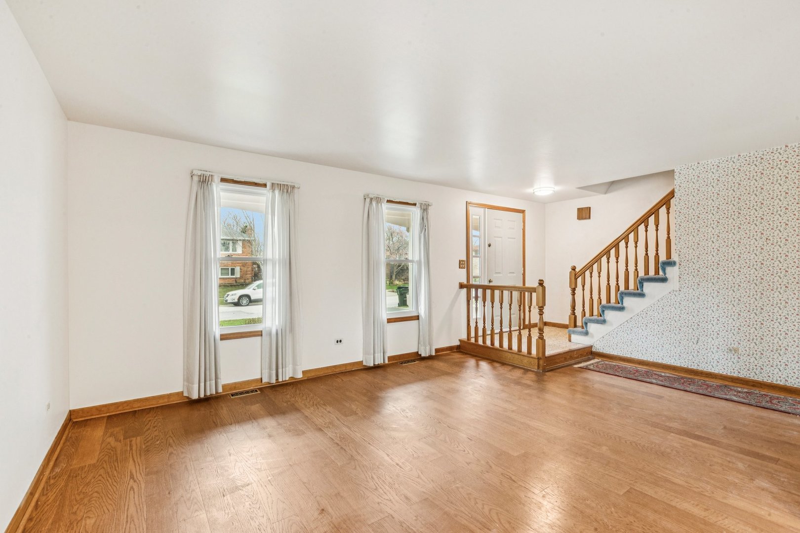 18604 Carpenter Street Homewood, IL 60430 - Photo 3 of 31 a view of livingroom with hardwood floor and windows